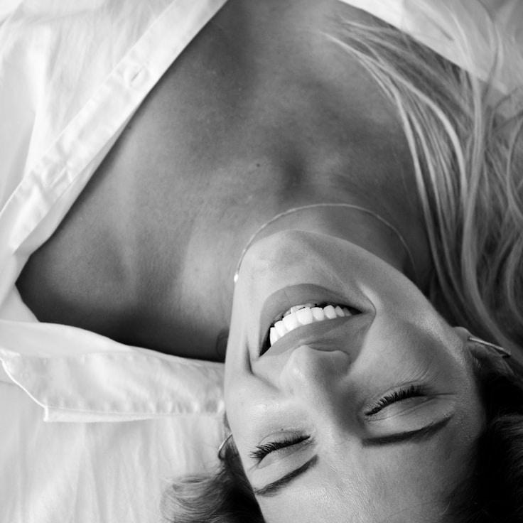 Kaveri Mehta, Lead Design Curator at Sparse Island Seek, reviewing corporate floral arrangements